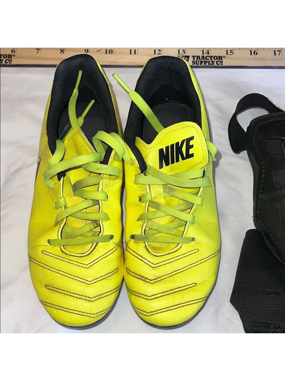 Nike Tiempo Kids Neon Yellow Cleats with leg guards. Size 3.5 Youth